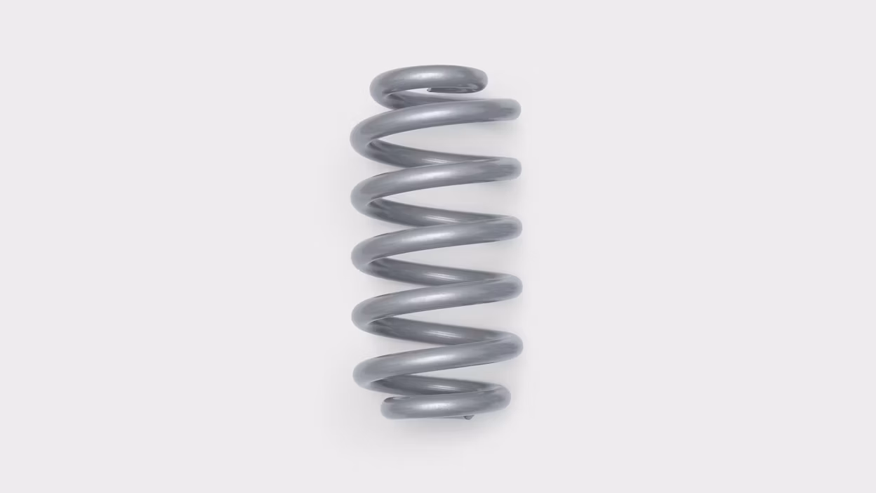 Metal coil spring on a white background.
