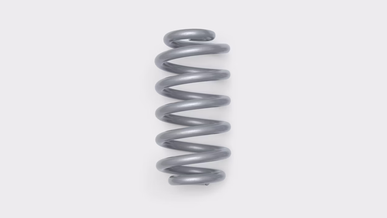 Metal coil spring on a white background.
