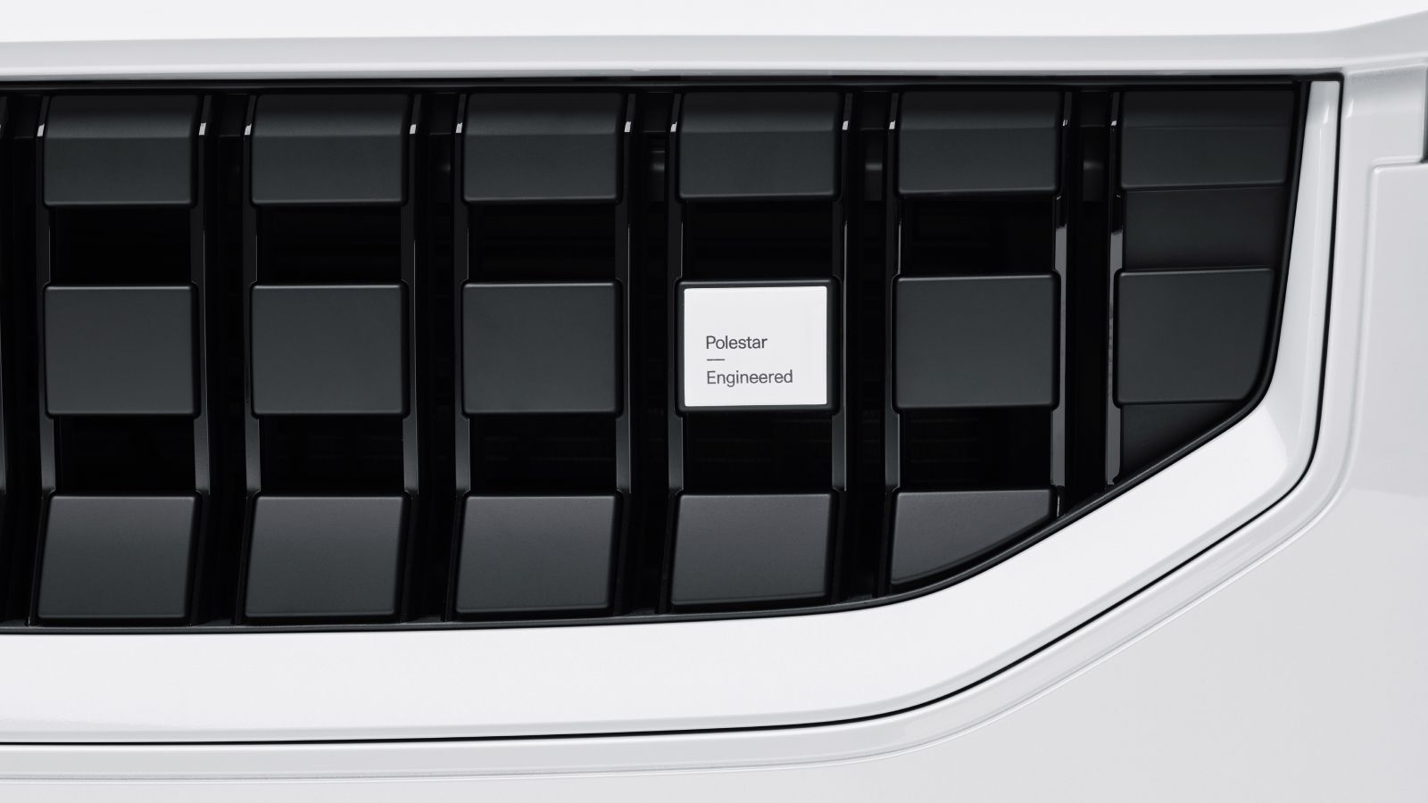 Detailed view over the front grille of white Polestar 2