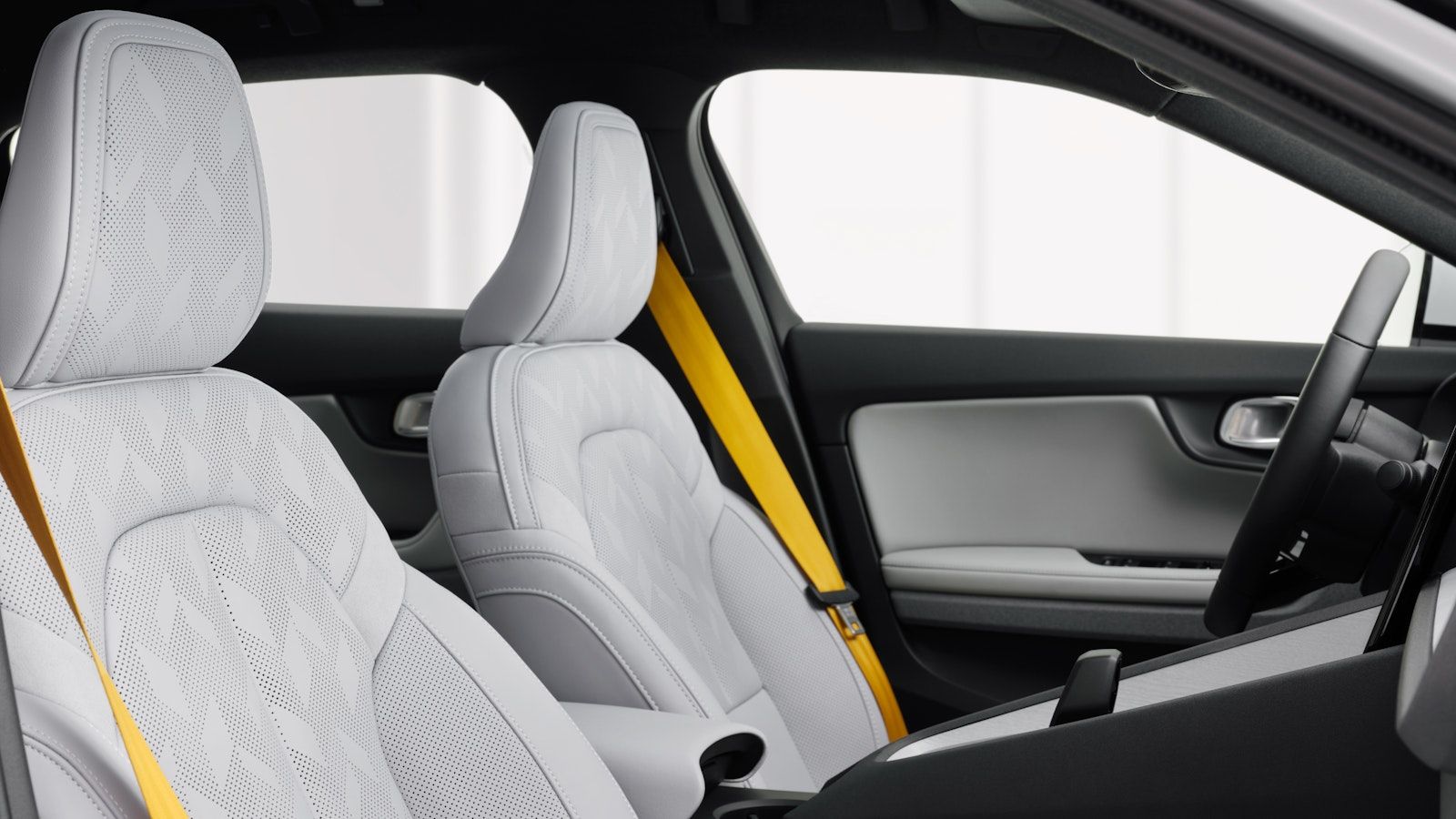 Grey seats and gold seatbelts in the Polestar 2