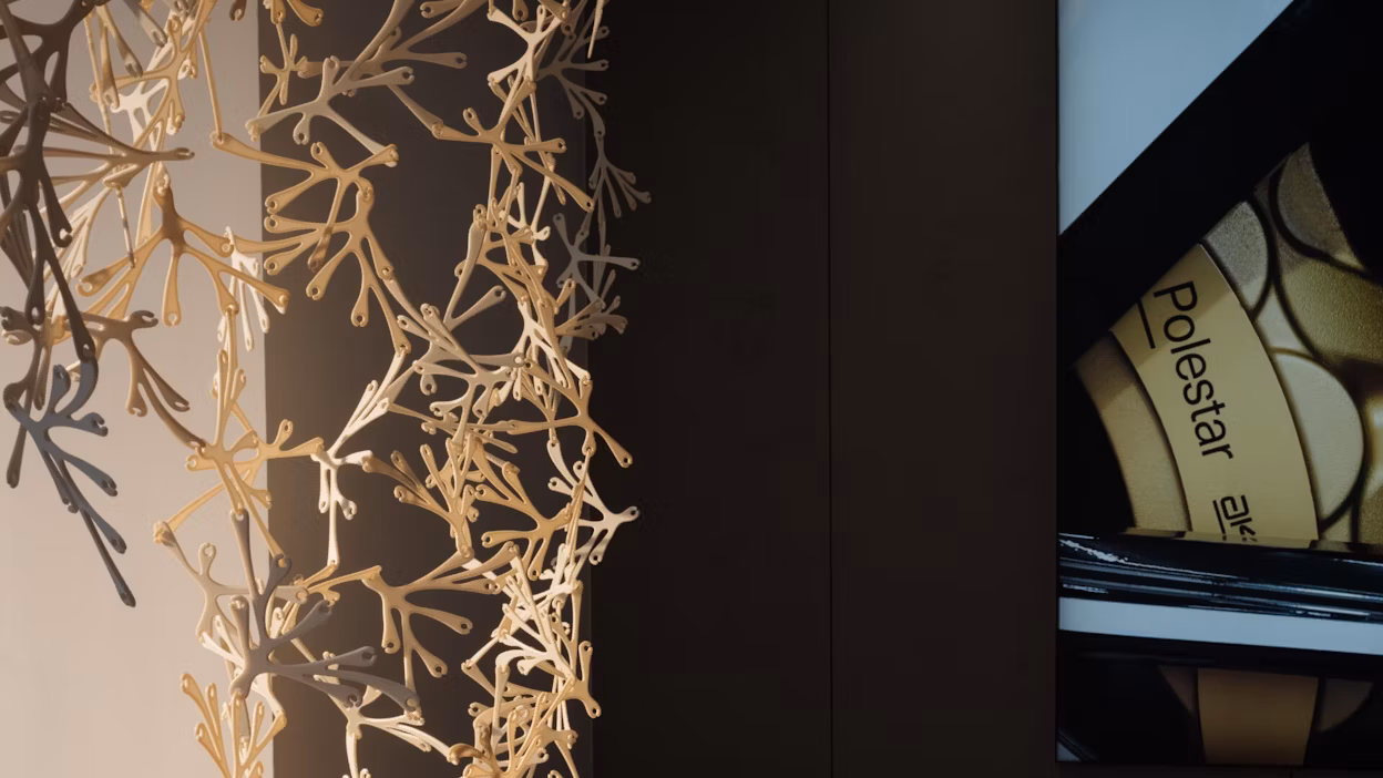 A modular room divider made from bioplastics in a Polestar space.