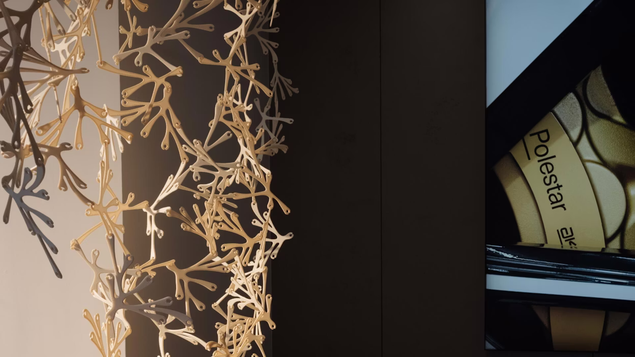 A modular room divider made from bioplastics in a Polestar space.