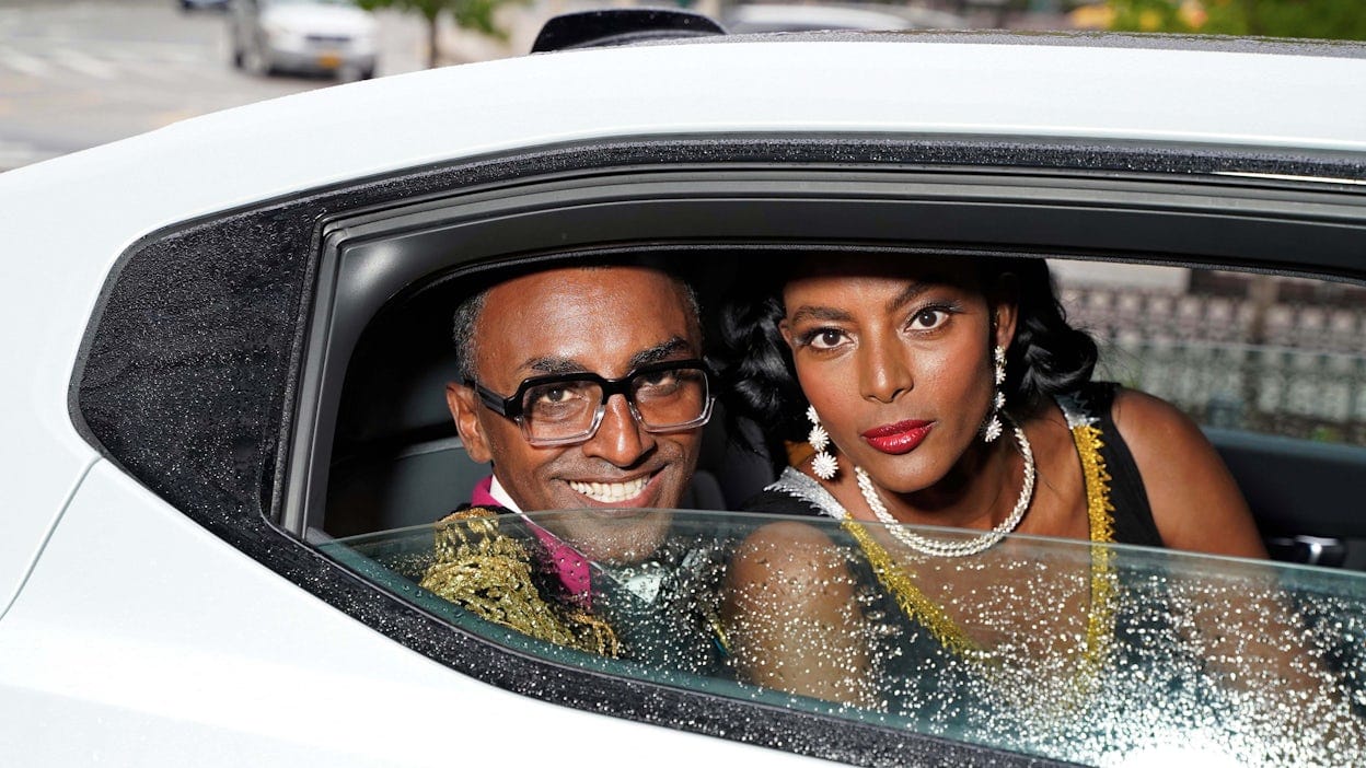 Marcus Samuelsson and Maya Haile in the back of a Polestar 2.