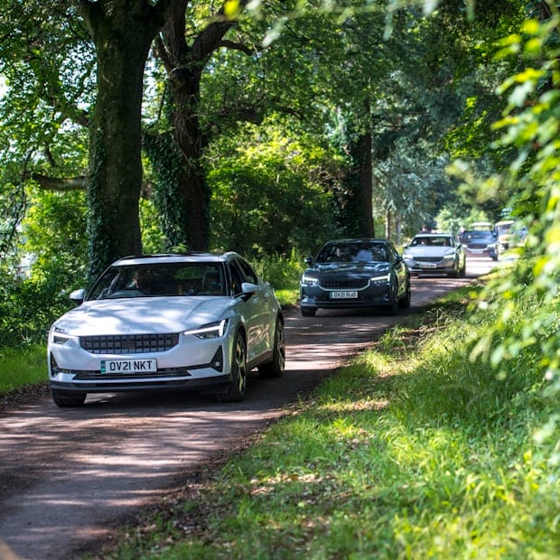 Polestar cars driving in the forrest surroundings of the Goodwood festival area.