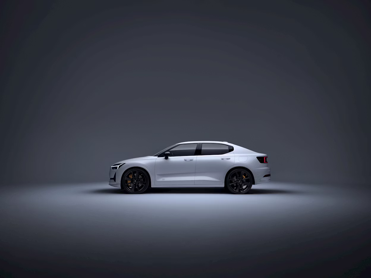 A white Polestar 2 in a studio.