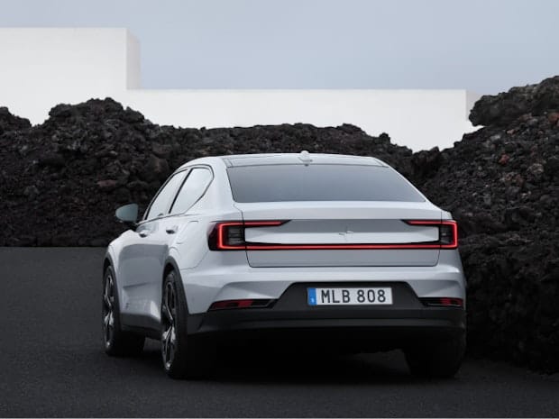 Rear side view of Polestar 2 in colour Snow 