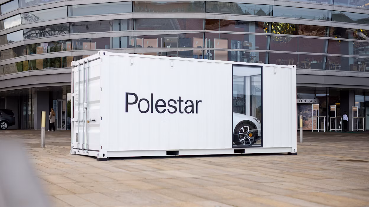 A Polestar displayed inside a container at the Global Fashion Summit.