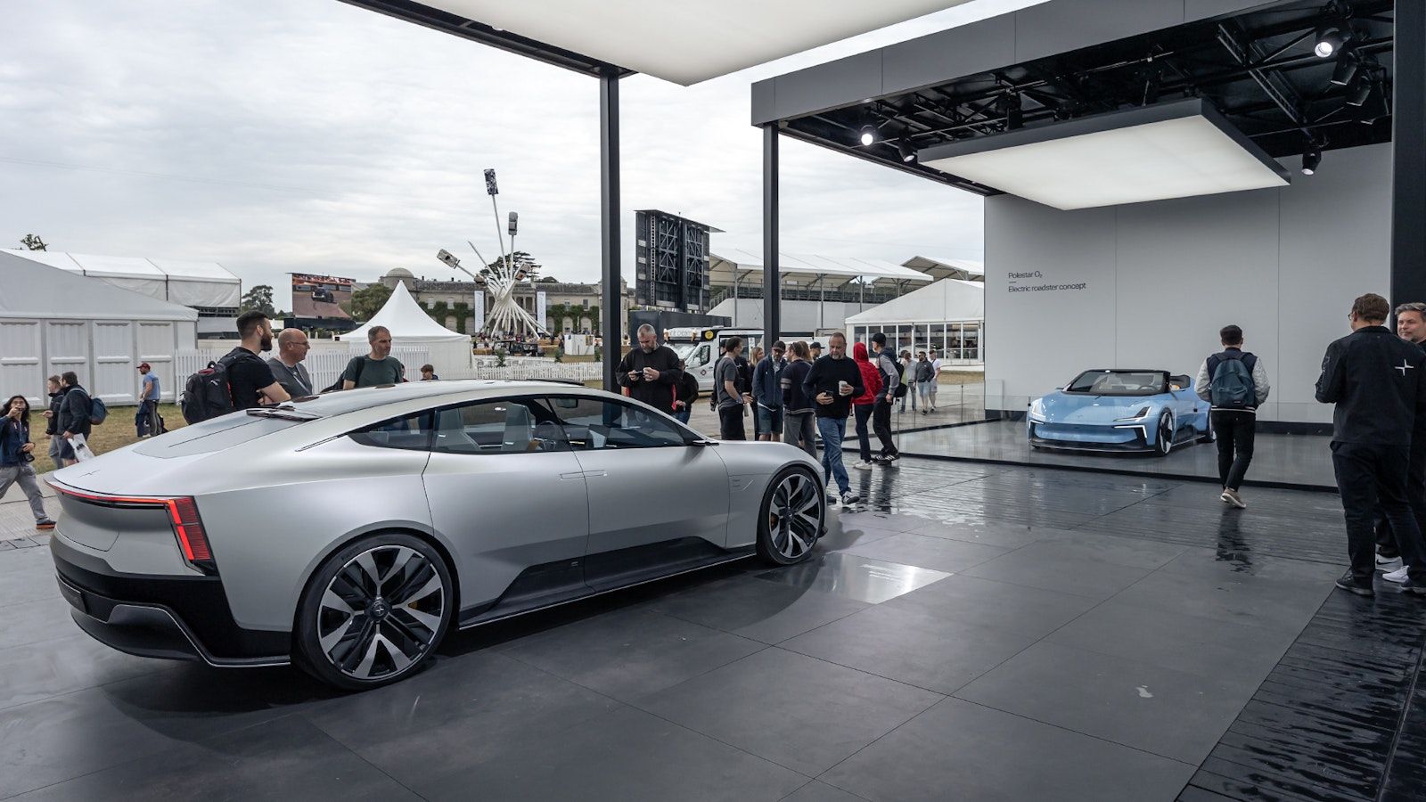 Blue Polestar electric roadster concept facing grey Polestar Precept GT concept at the Polestar stand. 