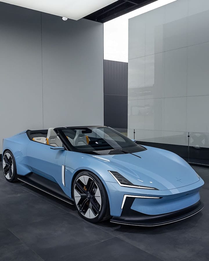 Blue Polestar electric roadster concept parked behind glass at the Polestar stand