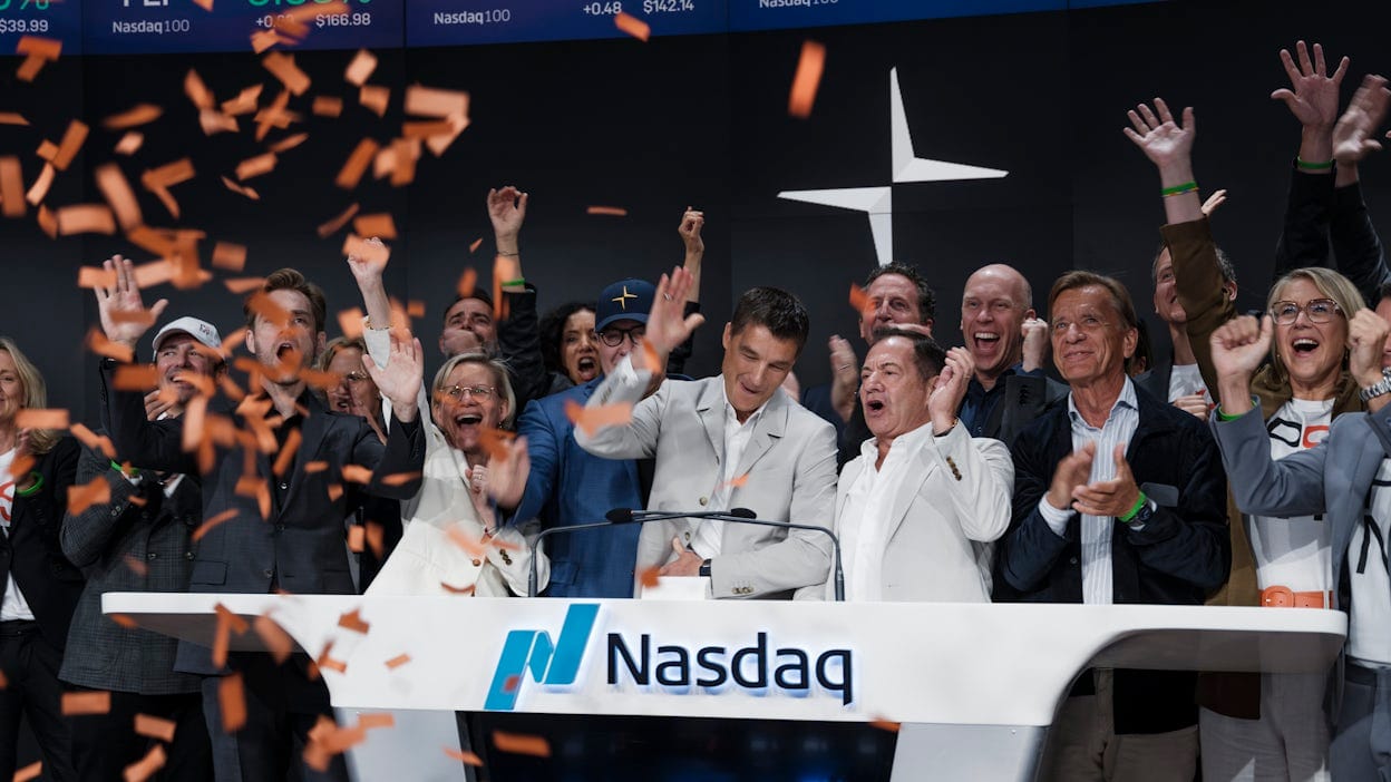 Thomas Ingenlath together with cheering people at bell-ringing ceremony at Nasdaq NY.