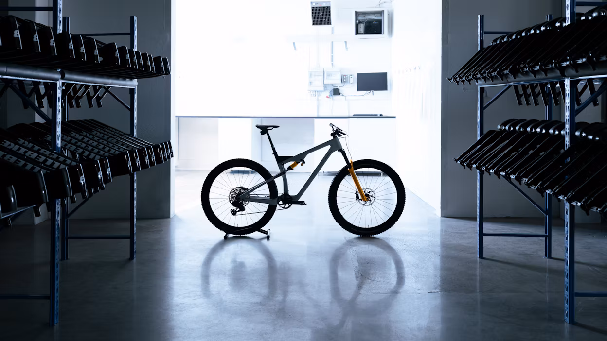 A backlit mountainbike in warehouse.