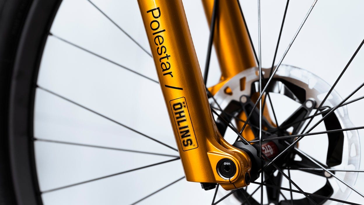 Golden dampers on a mountain bike. 