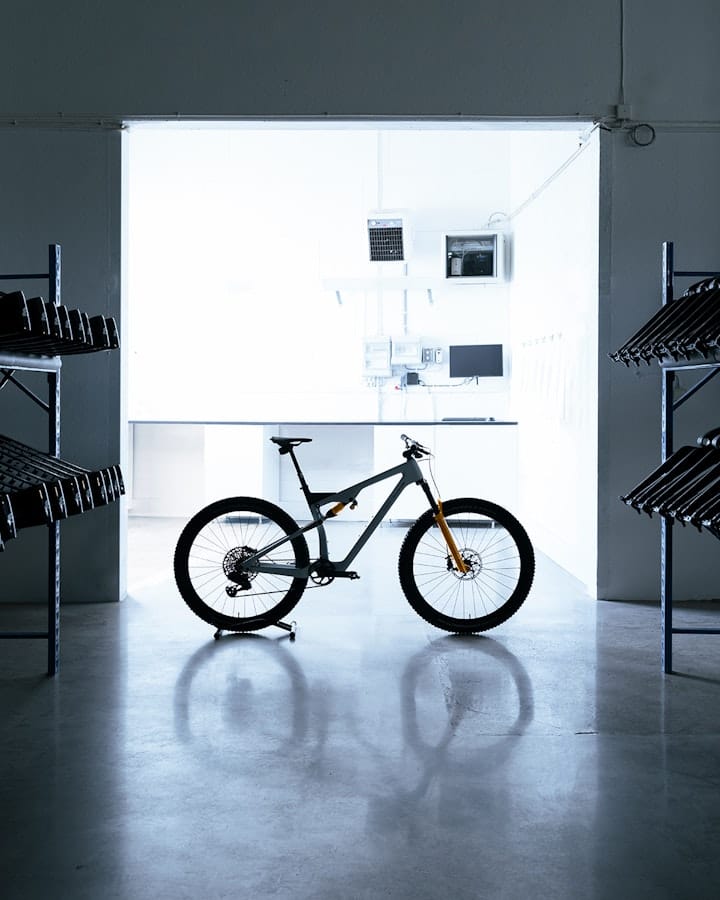 A backlit mountainbike in warehouse. 