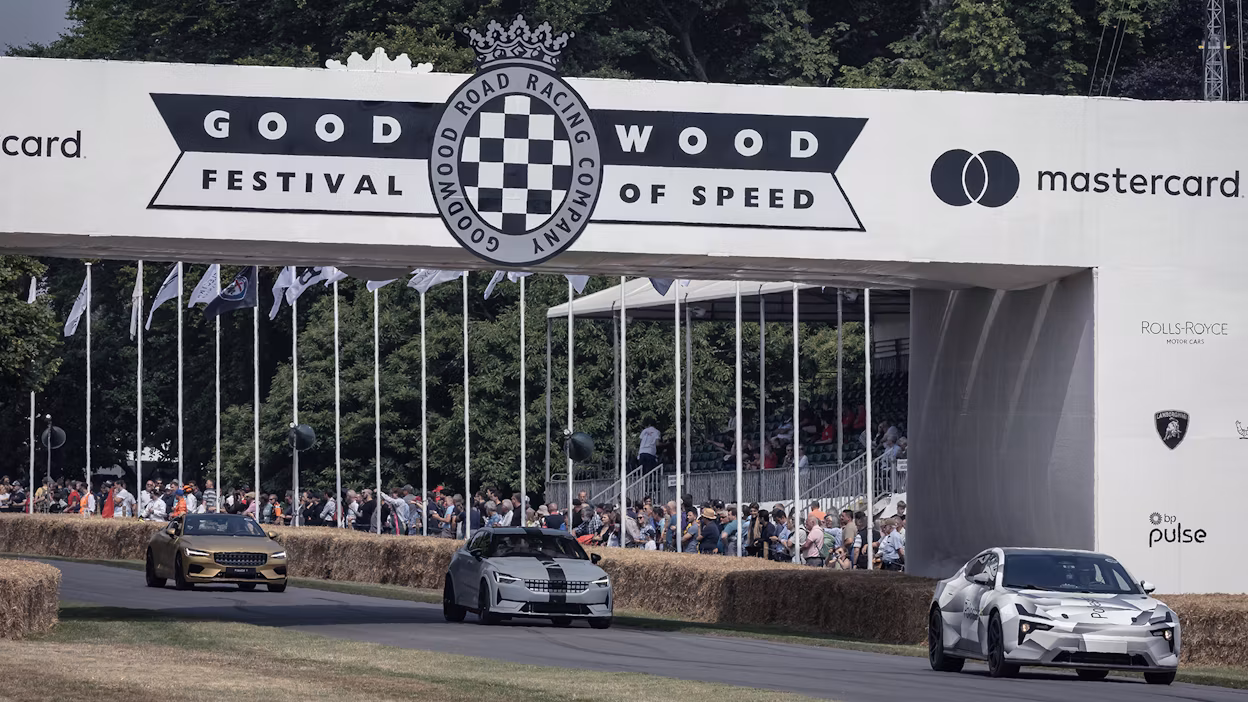 Polestar lineup at Goodwood Festival of Speed 2022 with crowd watching from the sidelines.