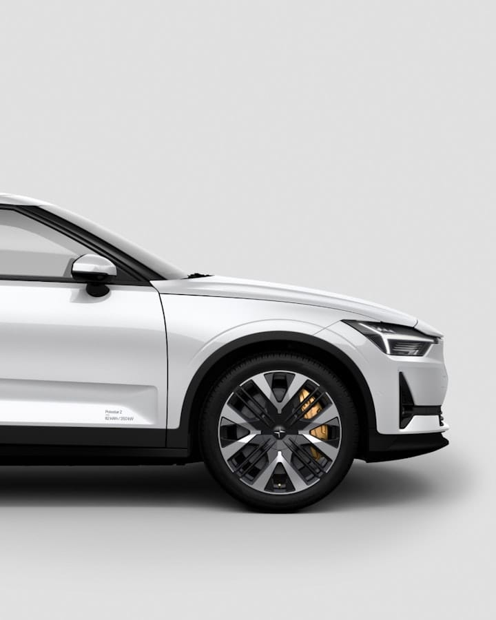 Polestar 2 in white showing from the side. Light grey background