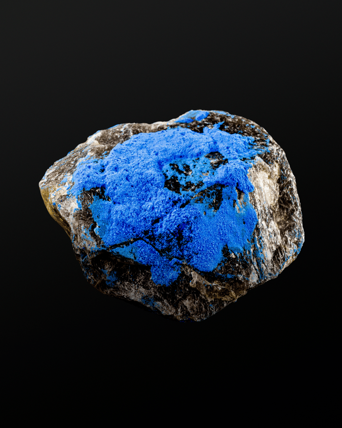 Cobalt blue rock on black background.