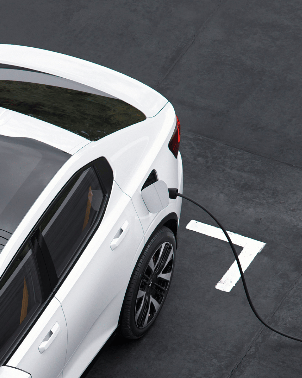 White Polestar 2 with charging cord connected