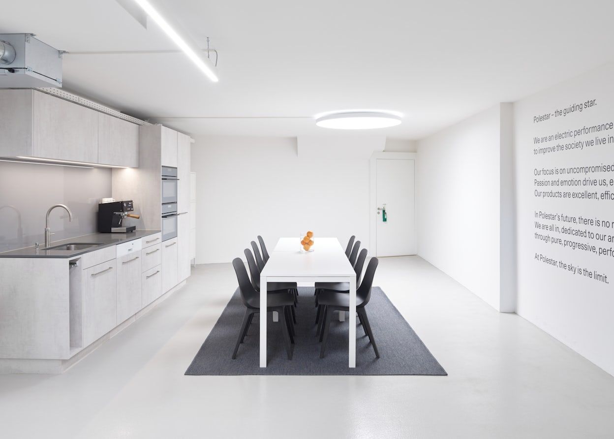 Polestar kitchen, light interior with black chairs