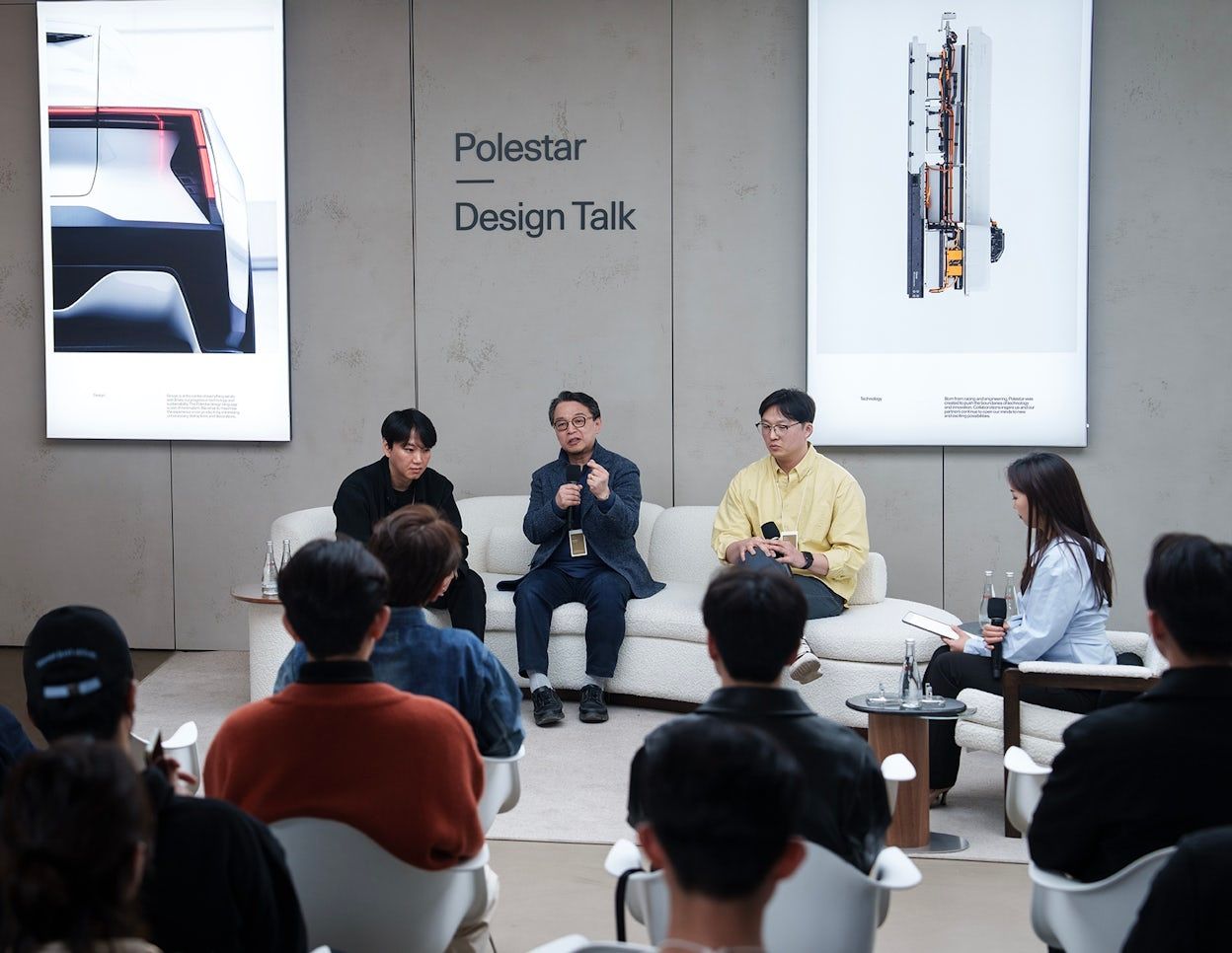 Polestar design talk, four persons talking in front of a group of people