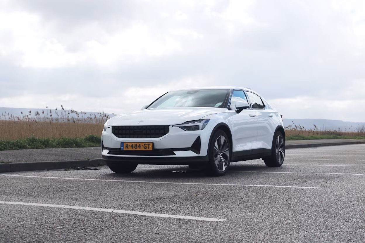 White Polestar standing on a parking lot outside in nature