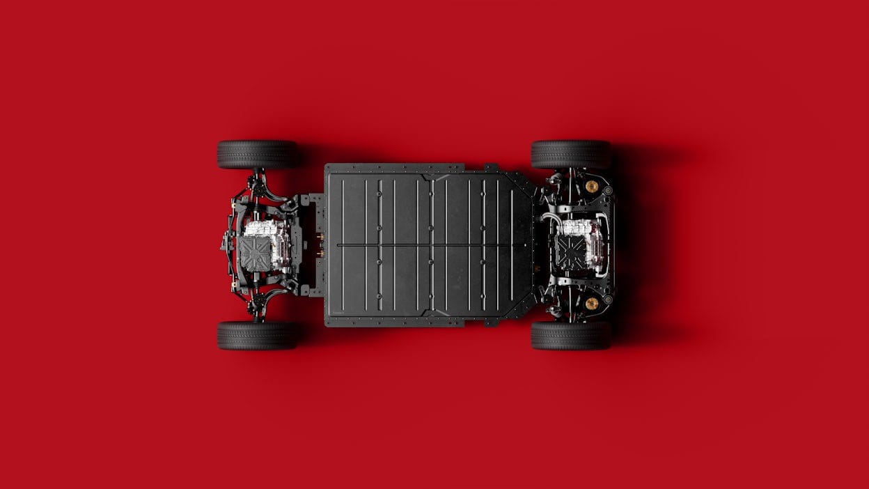 Polestar 4 seen from below against a red background