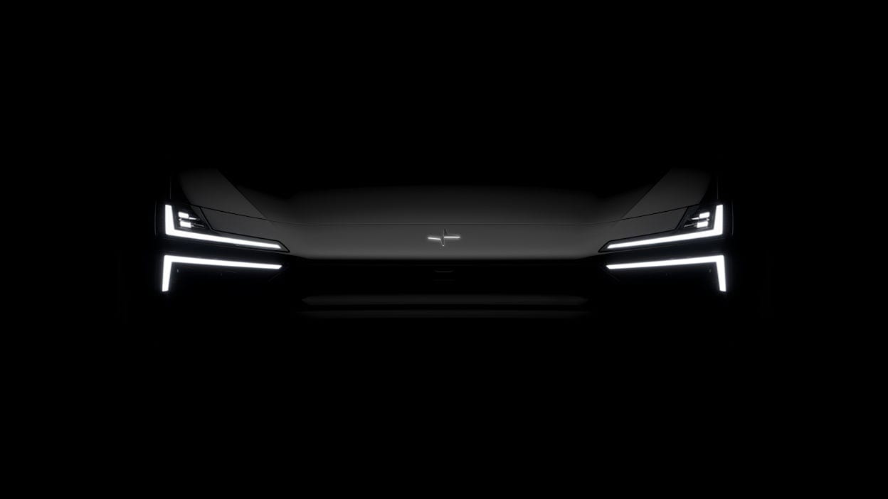 Dark image showing only the lights of the front of the car