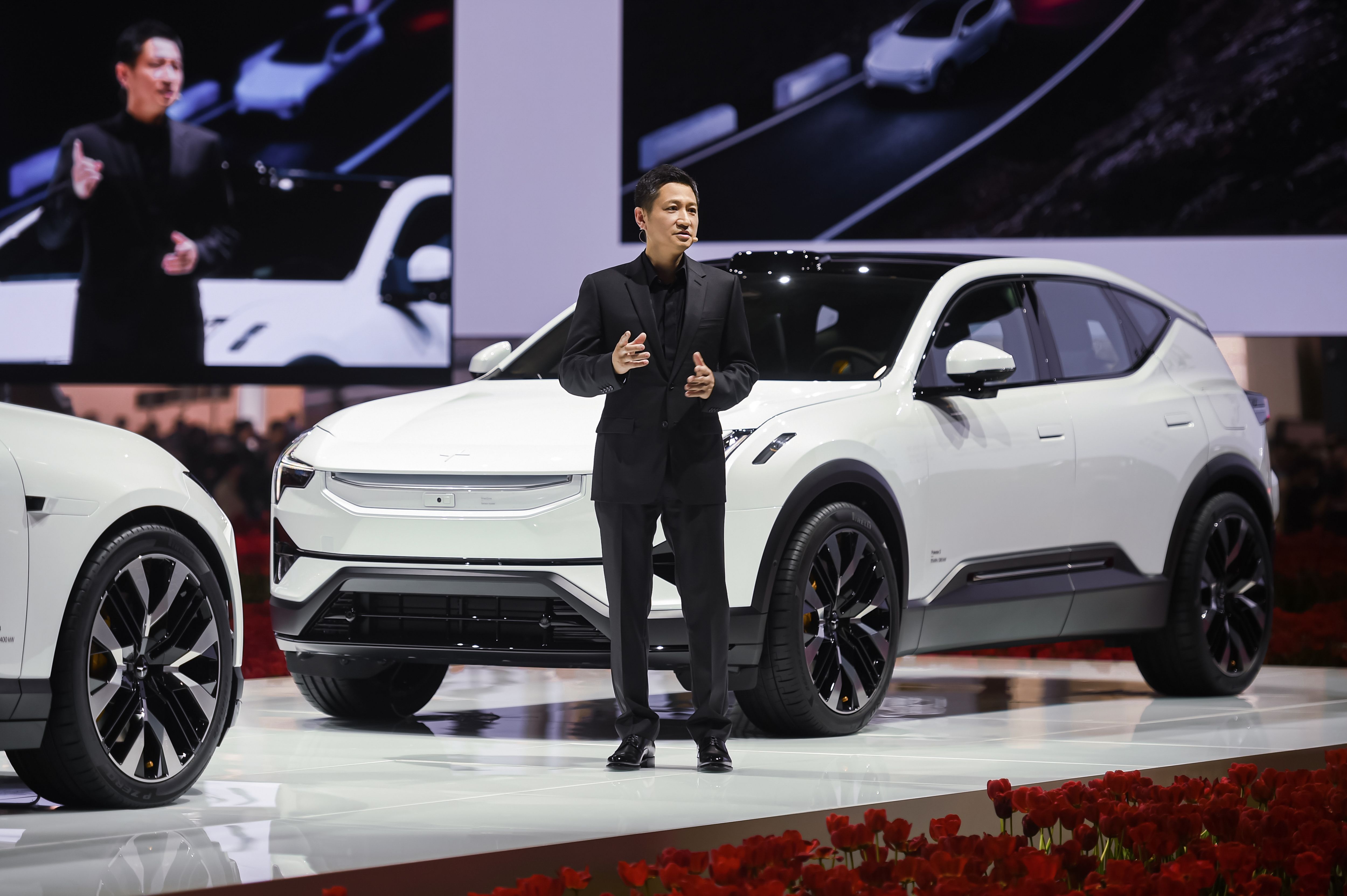 Man on stage infront of white Polestar 3