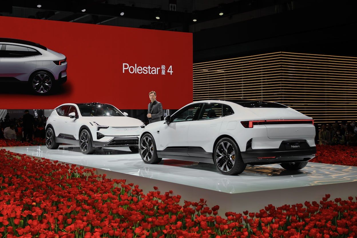 The launch of Polestar 4, Polestar 3 and 4 on stage together with a man