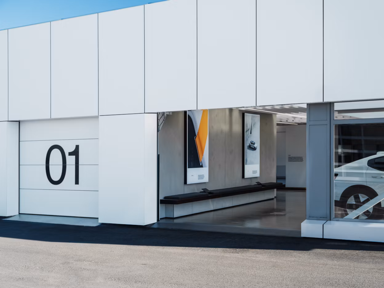 Exterior of Polestar space Moss, focus on a garage door with a large black 1 on it