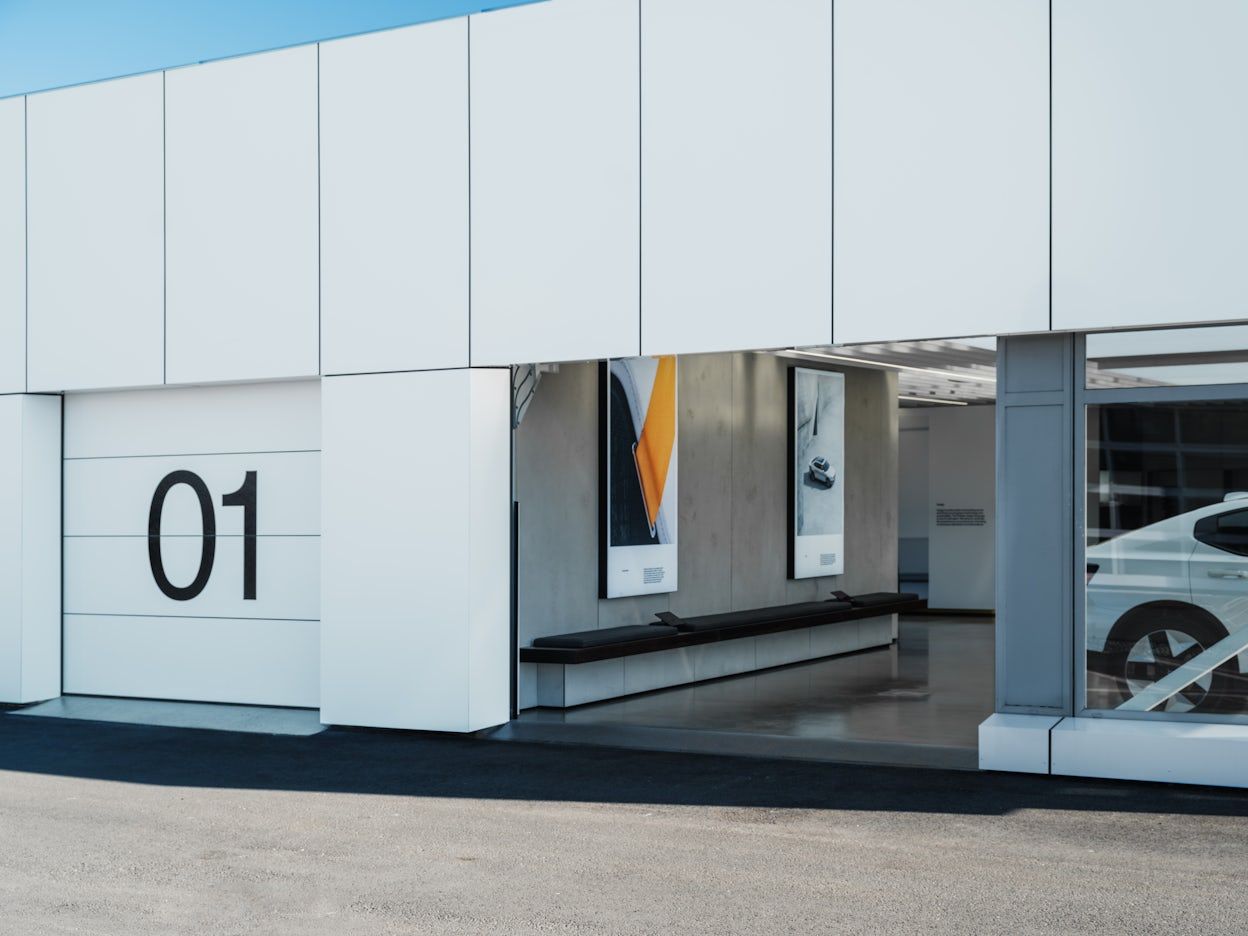 Exterior of Polestar space Moss, focus on a garage door with a large black 1 on it