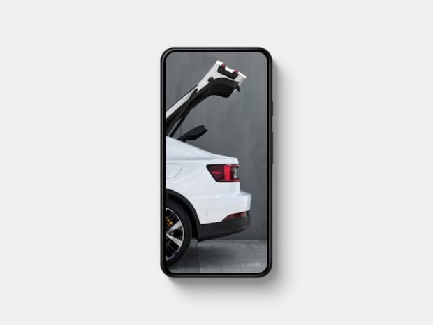 Polestar 2 with the tailgate open is shown on a phone