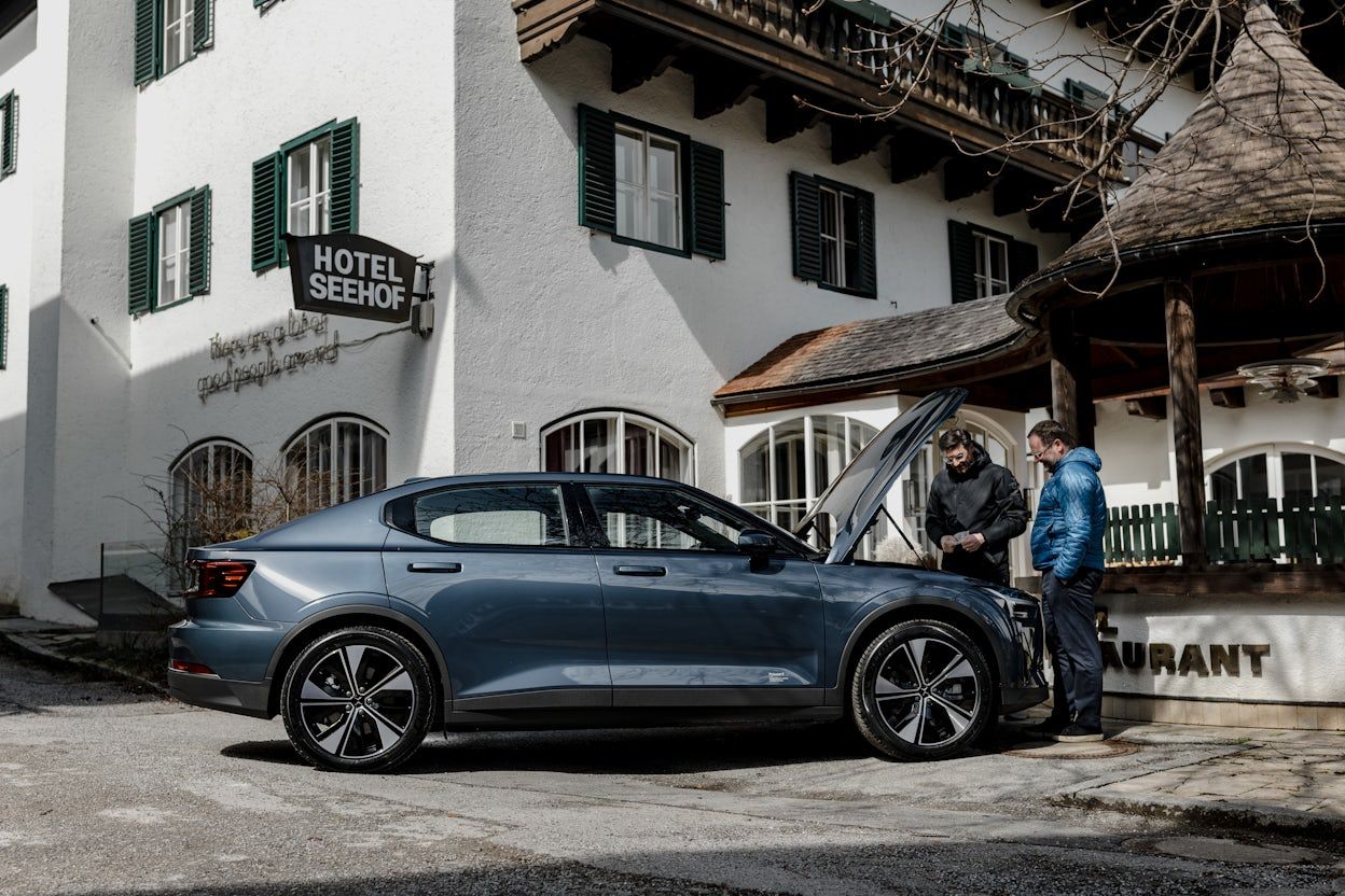 Polestar 2 infront of a hotel with the hood open