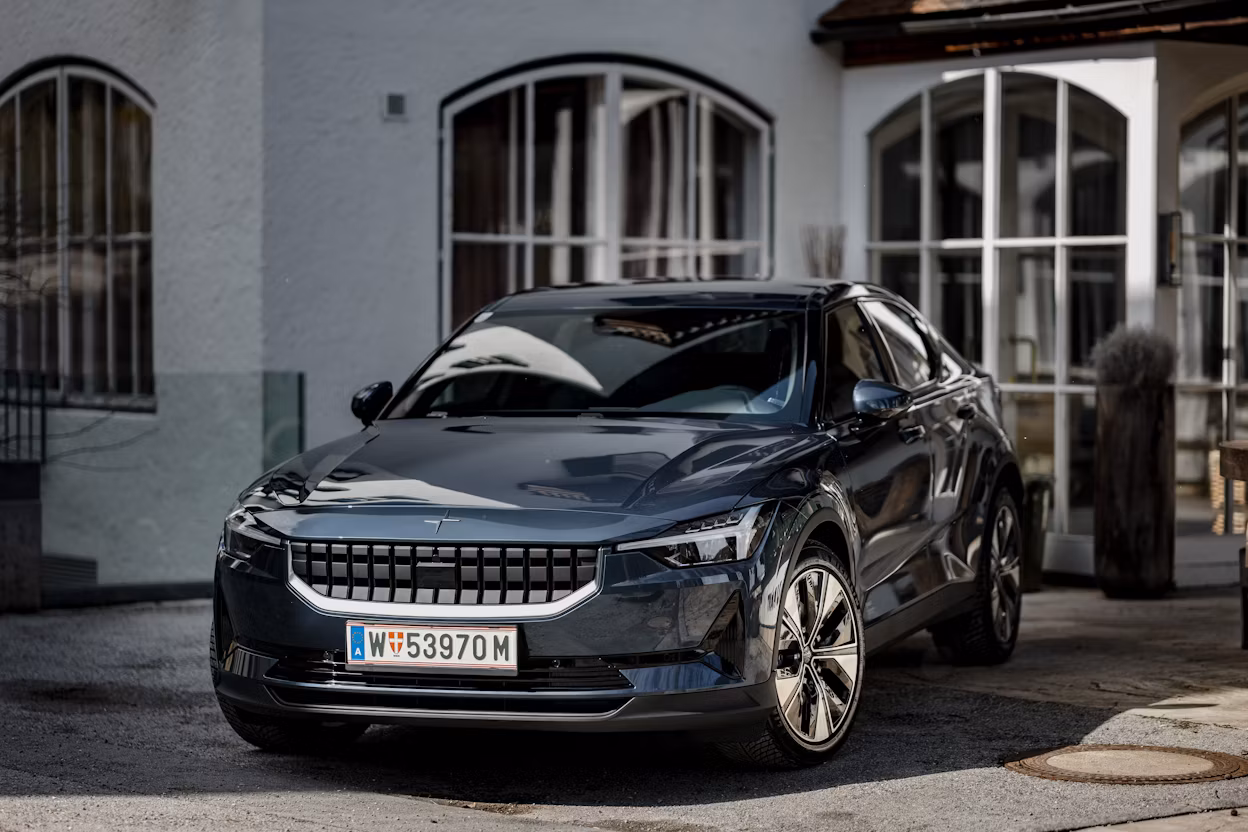 Polestar 2 standing infront of a old looking white building