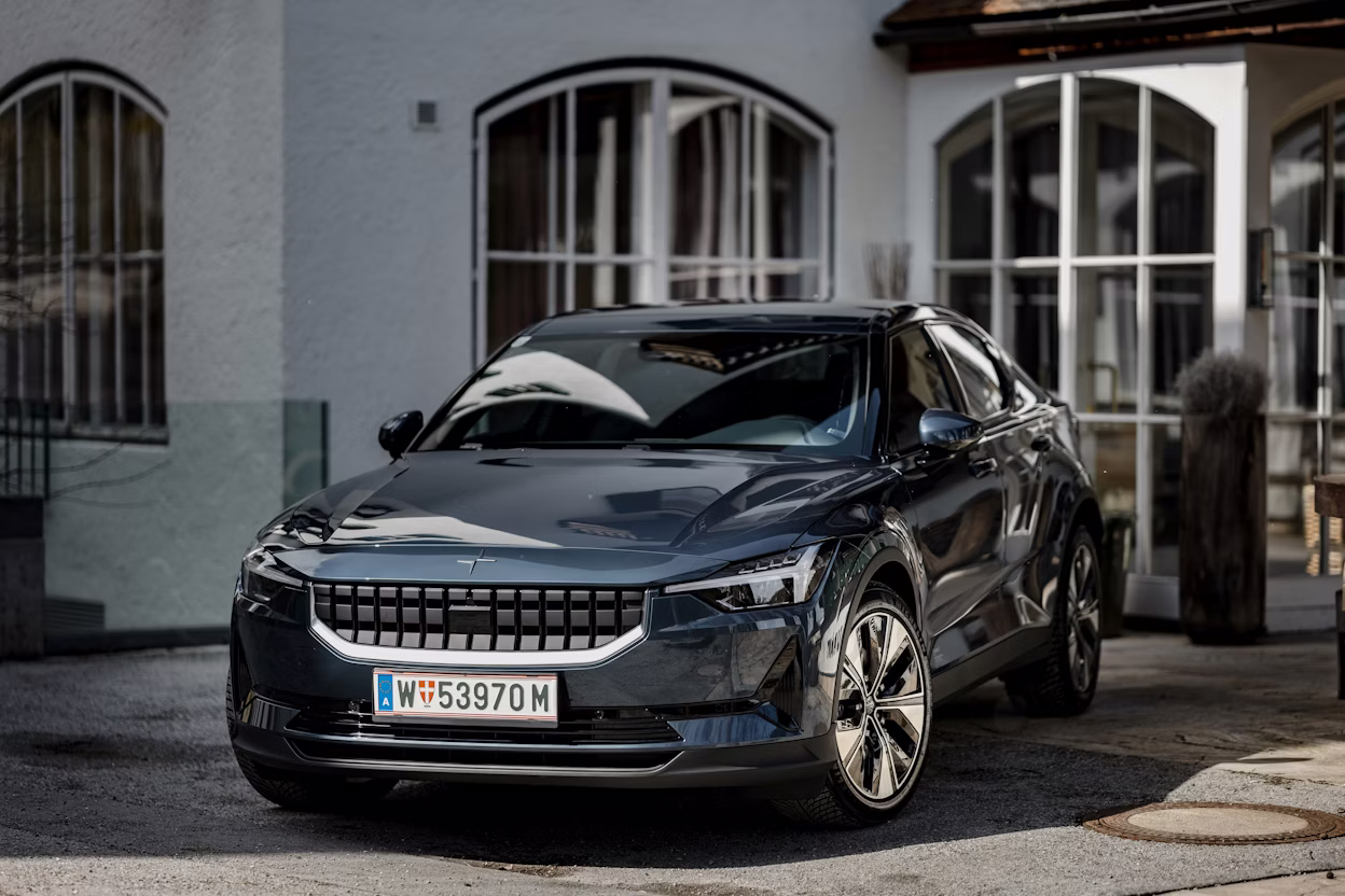 Polestar 2 standing infront of a old looking white building