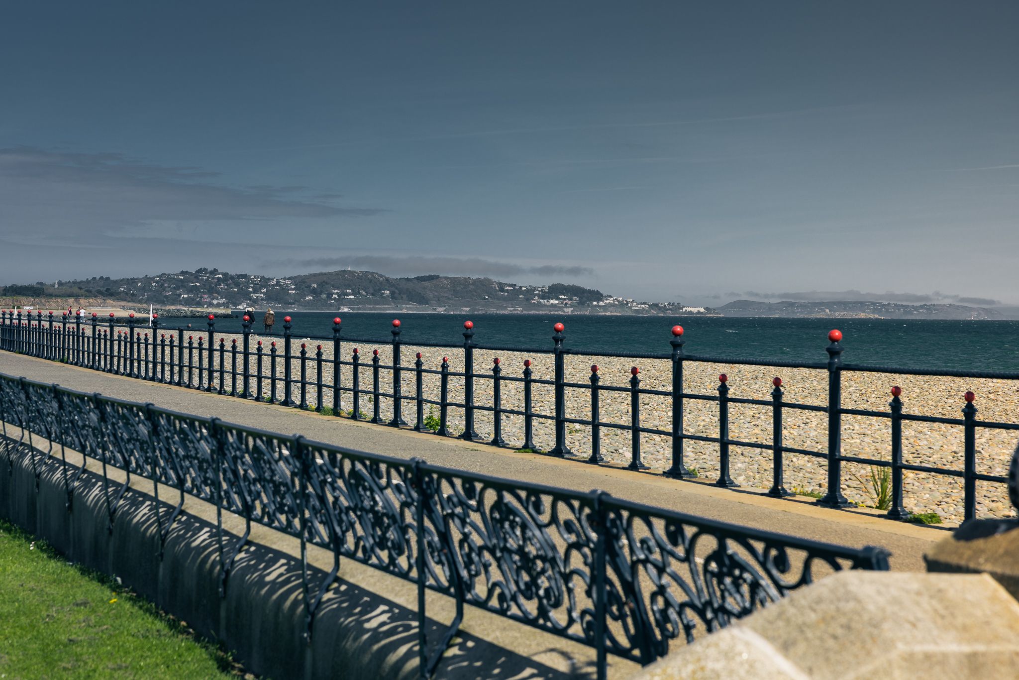 Old fashioned railings at a beach-front charging station