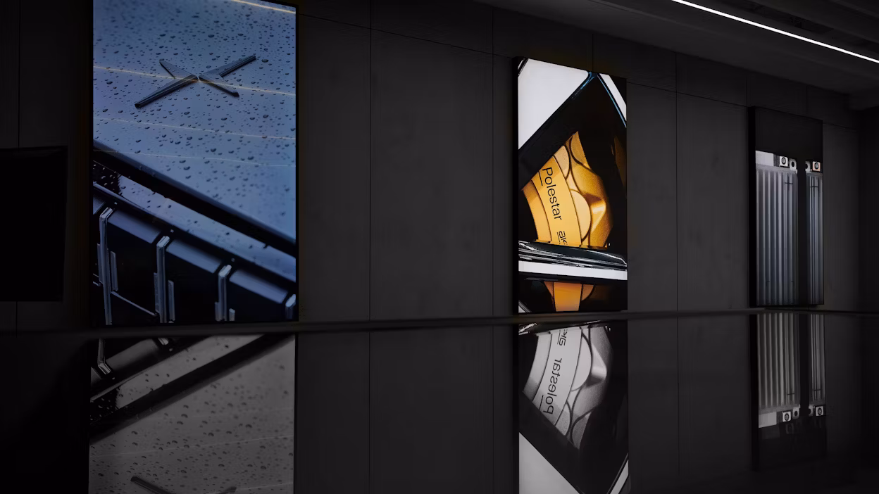 Exhibition space with Polestar images hanging on the wall.