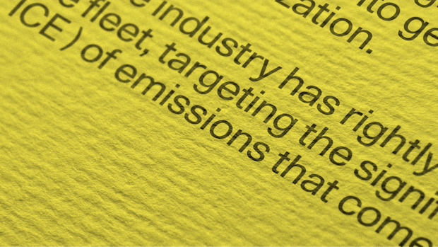 Close-up of a text displayed on a yellow background.