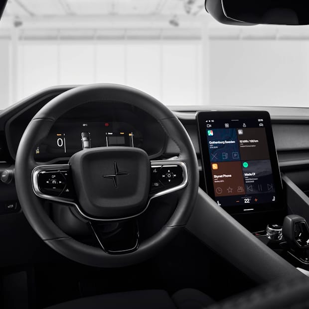 Interior of a Polestar 2 featuring a tablet and steering wheel.