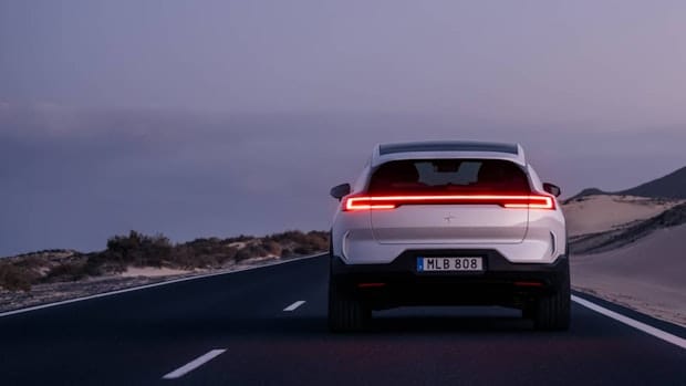 Rear view of a Polestar 3 in motion on a road