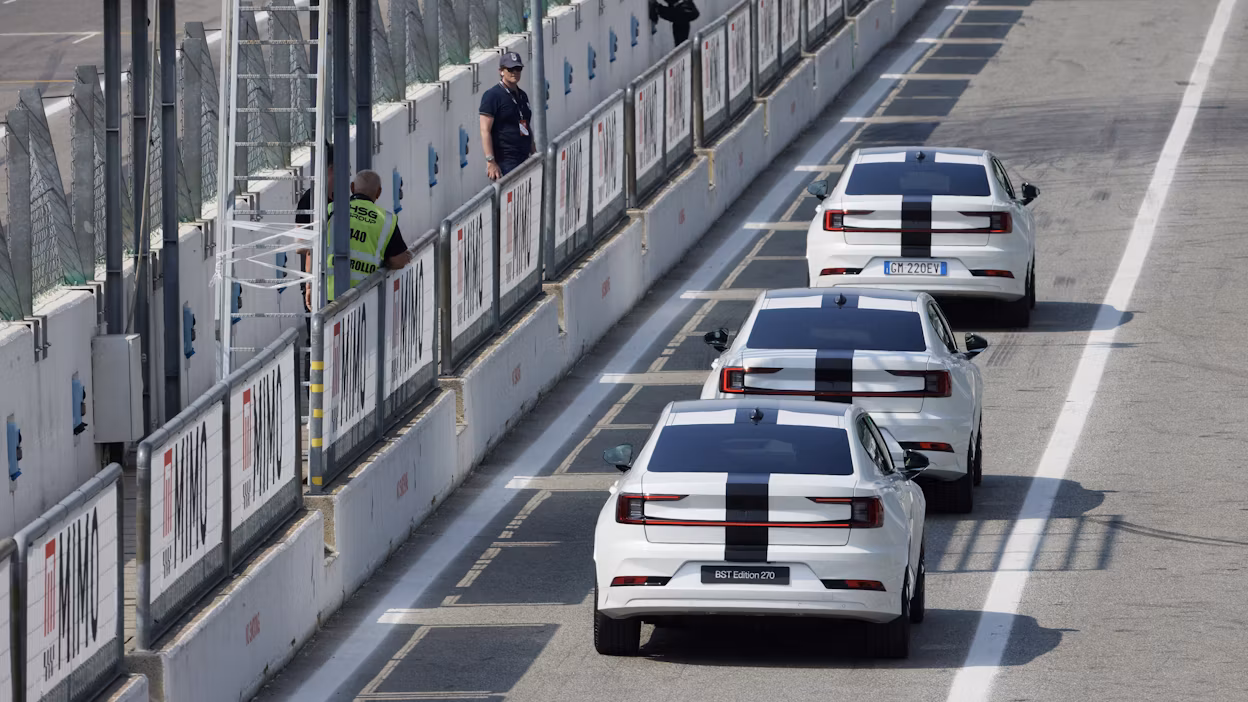 Three Polestar 2 BST edition 230 driving out of the pit lane
