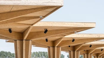 A row of wooden charging canopies