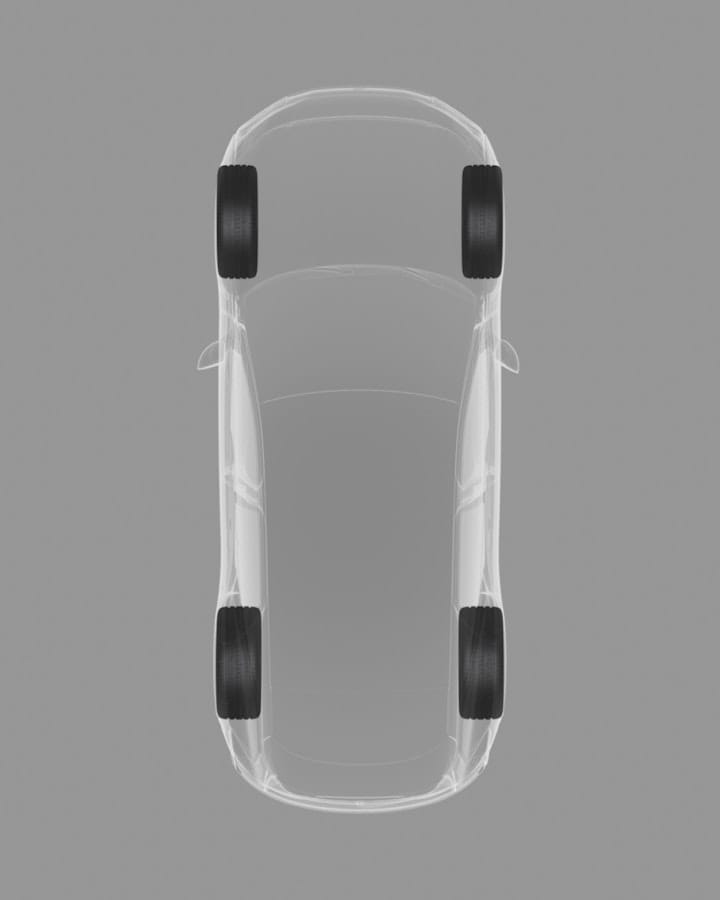Top-down view of the car on a grey background showing a graphical, x-ray of the staggered stance of the wheels.
