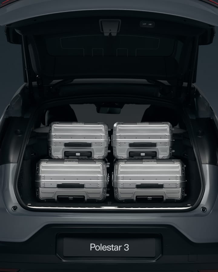 Back of the Polestar 3 filled with 4 large suitcases.