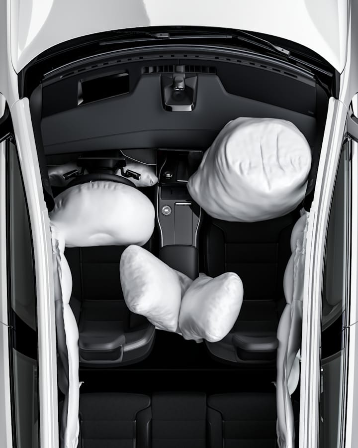 Top down image of the vehicle with the (side, centre and front) airbags expanded.