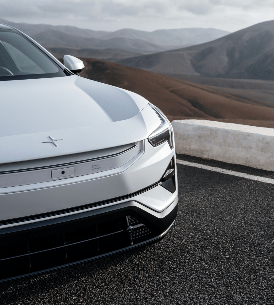 Close up on Polestar 3, in the background brown hills.
