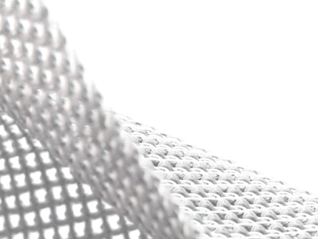 A white net shaped material on a white background.