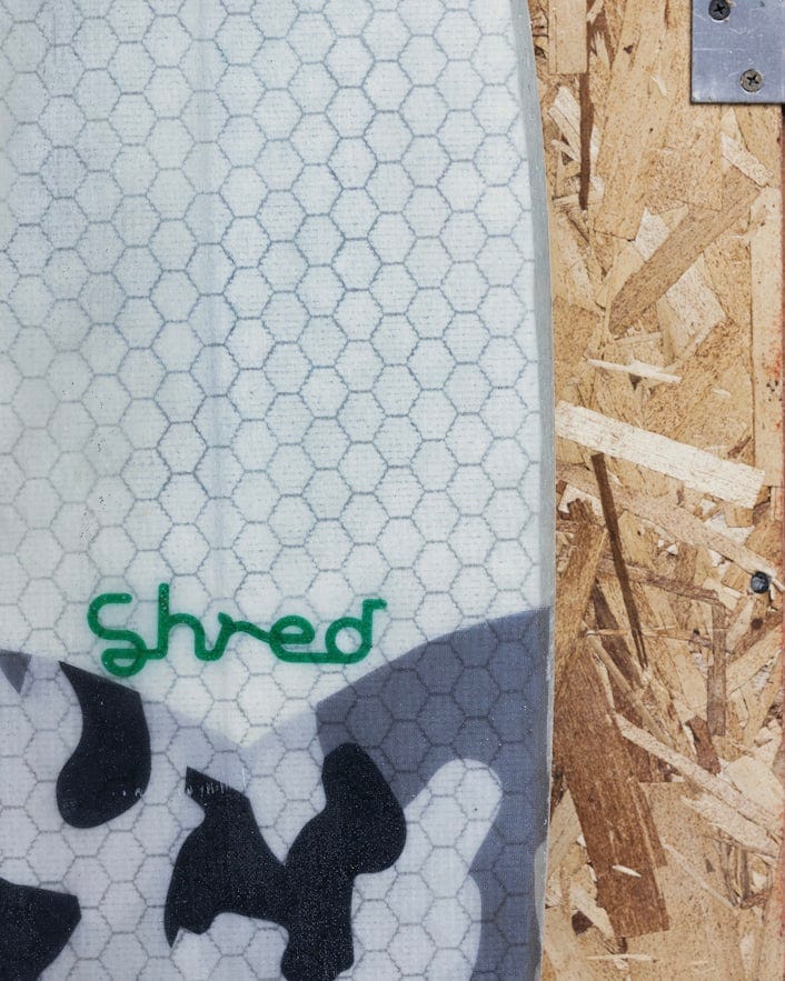 Close up of Shred scribble logo.