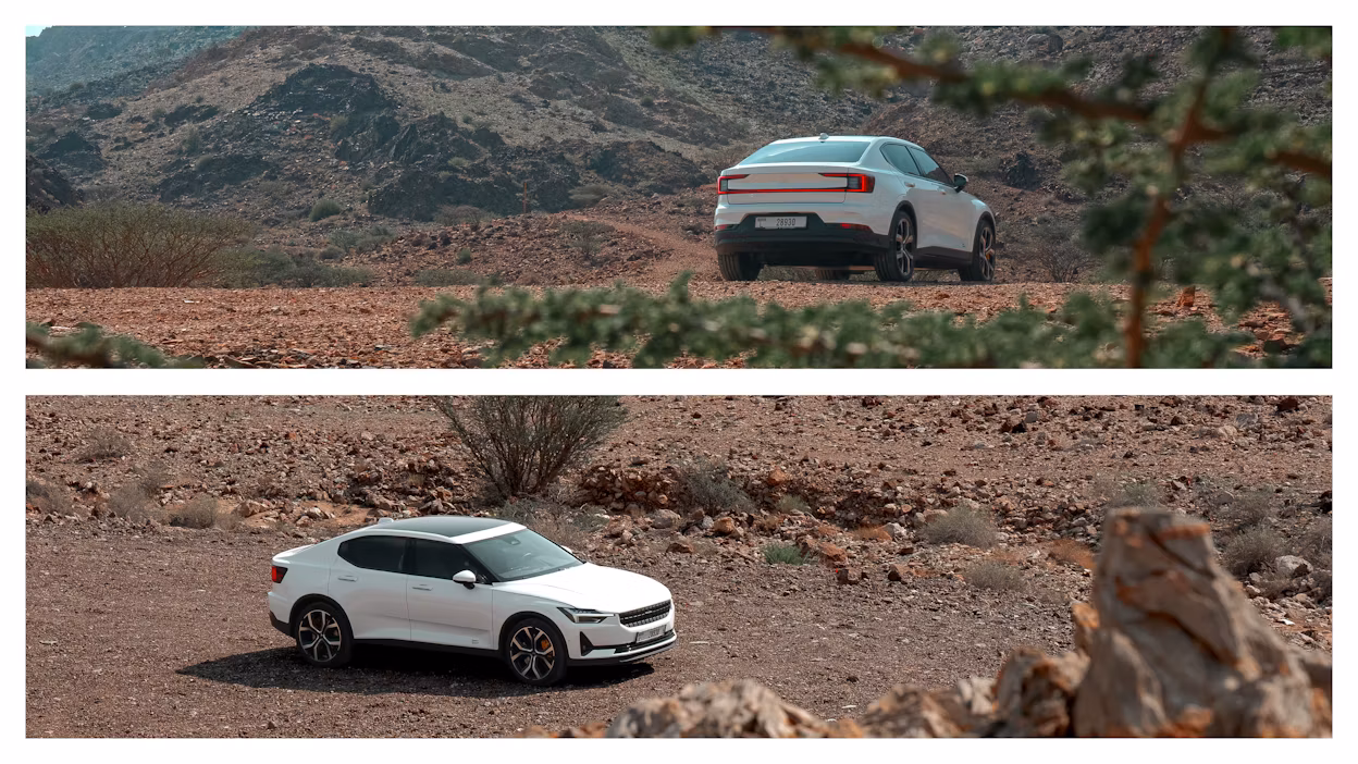 Polestar 2 in the Hajar mountains sourrounded by rock and sand.
