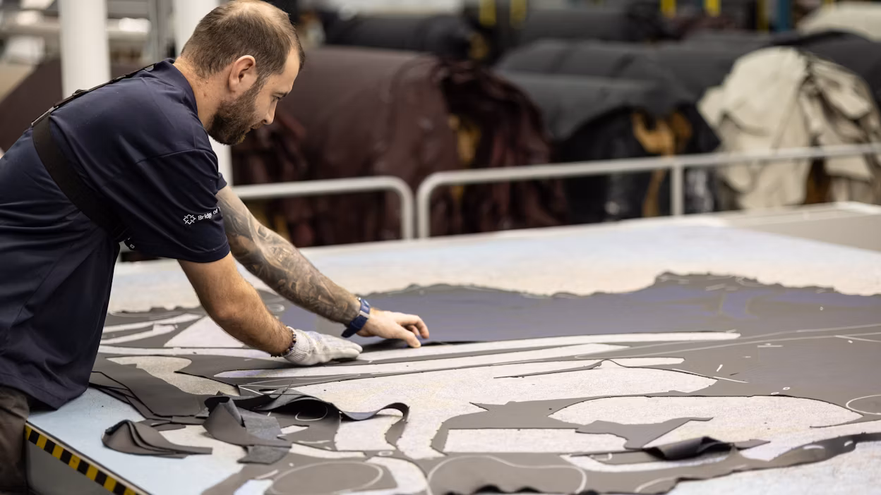 Cutting the leather.