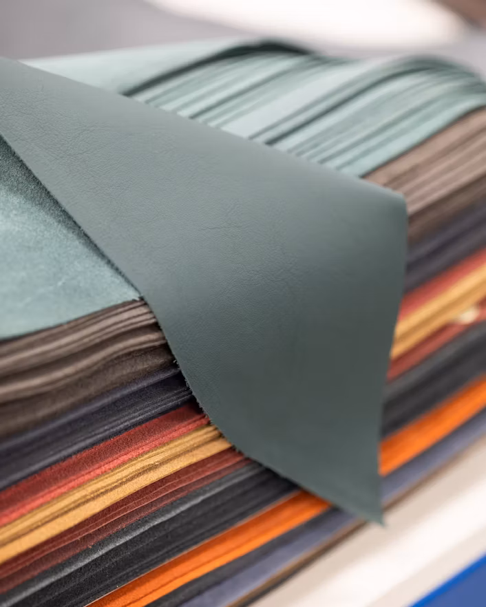 Stack of leather in different colours.